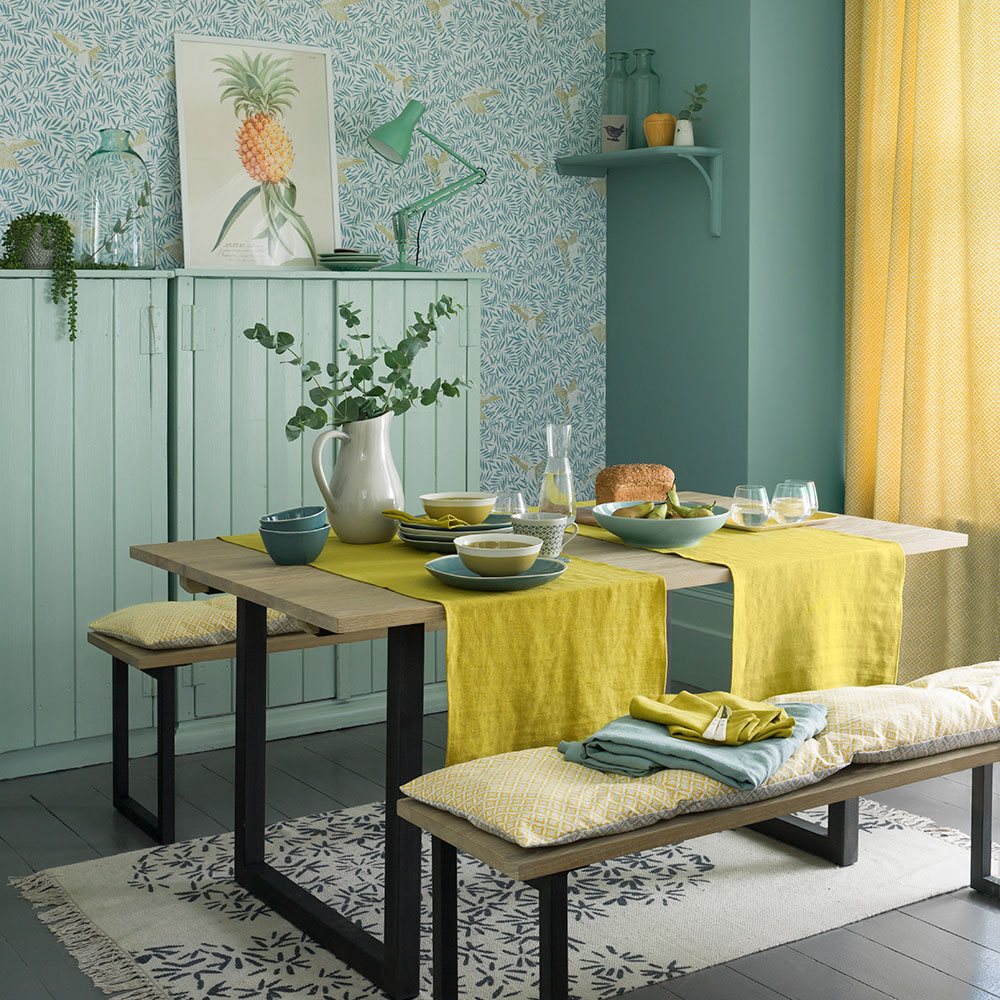 Country dining room with artisan block print wallpaper and yellow accents