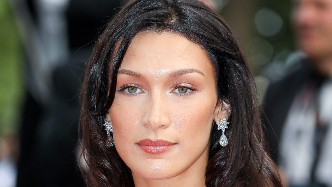 Bella Hadid Channeled the Frazzled English Woman Aesthetic with Honey Blonde Waves and Cozy Layers — See the Photos